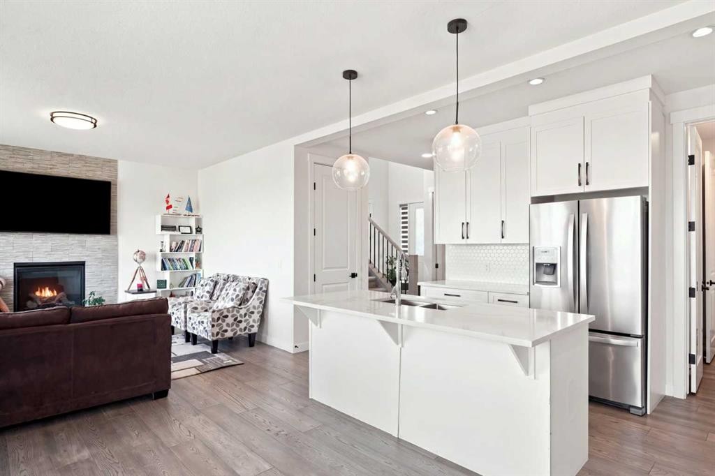 170 Chelsea Road, Chestermere, AB - Indoor Photo Showing Kitchen With Fireplace With Stainless Steel Kitchen With Upgraded Kitchen