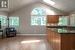 kitchen opens to the family room, vaulted ceilings with skylights