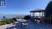 Spacious 624 sq ft entertaining deck with oceanside Gazebo. Expansive Views of the Strait of Georgia