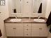 Ensuite bathroom with double sinks.