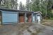 detached 10'x24' wood shed/garden shed, with sliding bay door.  16'x24' shop behind.