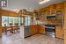 Beautiful kitchen with custom wood cabinetry, stainless appliances and natural light
