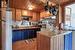 kitchen on main level, wood cabinets, butcher block laminate counters