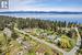 this property is second from the right, on upper Quadra Loop, road to the right leads to the public beach access on Wawakie Rd, a short walk away!