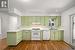 Kitchen With fresh Paint and new laminate flooring.