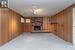 Cozy wood fireplace in lower level family room