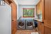 Laundry room featuring cabinets, independent washer and dryer, light tile flooring, and washer hookup