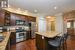 Granite counters, large island, pantry space and stainless steel appliances