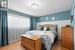 Bedroom featuring light hardwood / wood-style floors and a textured ceiling