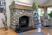 River Rock fireplace with effecient woodstove insert