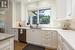 Kitchen with dishwasher, tasteful backsplash, white cabinetry, light wood-type flooring, and sink