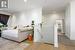 Bedroom with ornamental molding and light hardwood / wood-style flooring