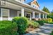 Large covered front porch with stamped concrete surface