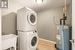 Proper laundry/utility room with laundry tub, hot water heater is owned