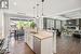 Open Concept Kitchen / Living / Dining Room Overlooking Back Yard Oasis