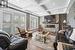 Coffered ceilings, potlights, and an Electric Fireplace in the Living Room Overlooking the Back Yard