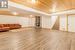 This massive family room / rec room over brand new flooring features a knotty pine ceiling & the 3rd of 3 fireplaces, this one being a wood burning unit.