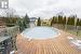Above ground pool with wood decking surround