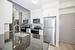 Kitchen with grantie counter tops and mirrored wall