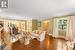 Living and dining room. Refinished dark brown quarter-cut oak hardwood. Gas fireplace. Crown moulding. Plaster walls.