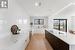 Kitchen with view to sliding doors. Steps down to private fenced patio