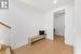 Mudroom. Built in bench. 2 huge double closets on right wall. Washroom. Glass stairway to upper level.