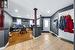 Foyer entrance with ornate columns and light hardwood / wood-style floors