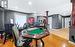 Rec room with ornate columns and light hardwood / wood-style flooring