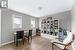 Office space with light hardwood / wood-style floors and a textured ceiling