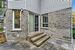 Doorway to property featuring a patio area