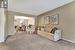 Living room featuring a textured ceiling,  and carpet floors