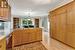 Kitchen with sink, kitchen peninsula, decorative light fixtures, stainless steel dishwasher, & laminate