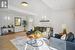 Living room featuring hardwood / wood-style flooring and beamed ceiling