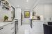 Kitchen featuring a healthy amount of sunlight, appliances with stainless steel finishes, sink, and white cabinets