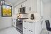 Kitchen with white cabinets and stainless steel appliances