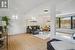 Living room featuring beamed ceiling and light wood-type flooring