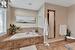 Bathroom with tiled tub and tile patterned floors