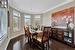 Dining area featuring dark hardwood / wood-style flooring and ornamental molding