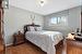 Bedroom featuring dark hardwood / wood-style flooring