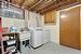 Laundry room featuring cabinets, washer and dryer, and sink