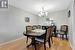 Dining area featuring a chandelier and hardwood / wood-style flooring