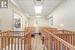 Hall featuring light hardwood / wood-style floors and a drop ceiling