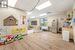 Playroom featuring light hardwood / wood-style flooring, a drop ceiling, and sink