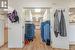 Spacious closet with light hardwood / wood-style flooring