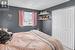 Bedroom featuring a textured ceiling and a closet