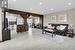 Living room with beam ceiling and light wood-type flooring