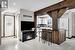 Kitchen featuring white cabinetry, a kitchen island, and light hardwood / wood-style floors