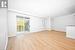 Unfurnished room with crown molding and light wood-type flooring