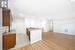 Kitchen featuring stove, light wood-type flooring, and ornamental molding