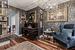 Living area with a chandelier, dark hardwood / wood-style floors, and ornamental molding